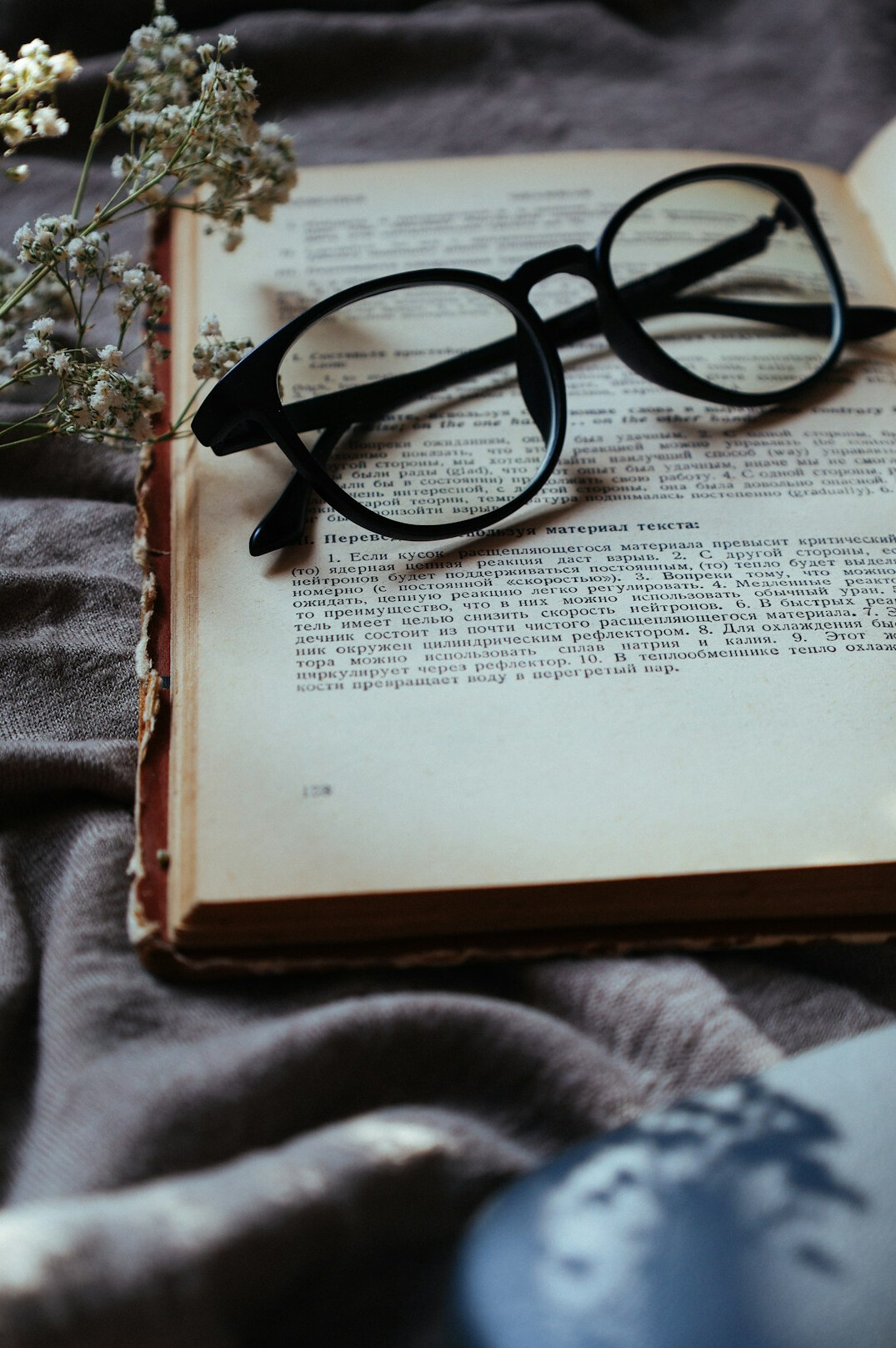 old book with glasses