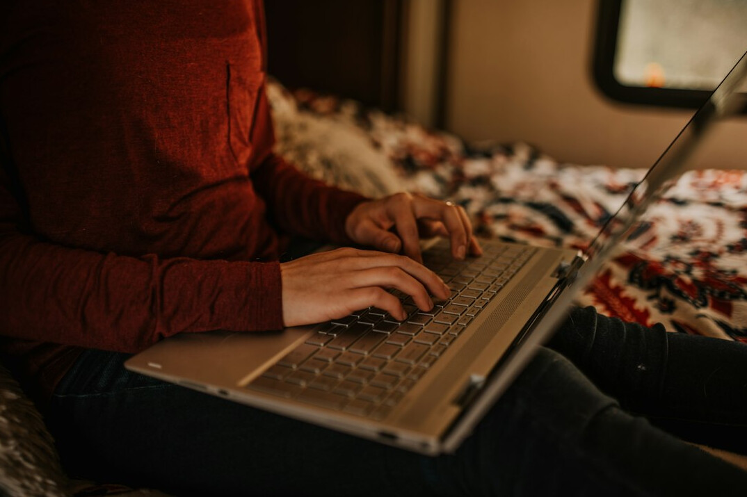 person using laptop at night